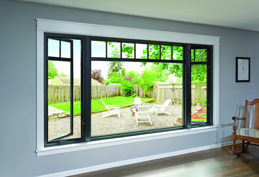 Indoor view of Renewal By Andersen Window looking into backyard with chairs and firepit