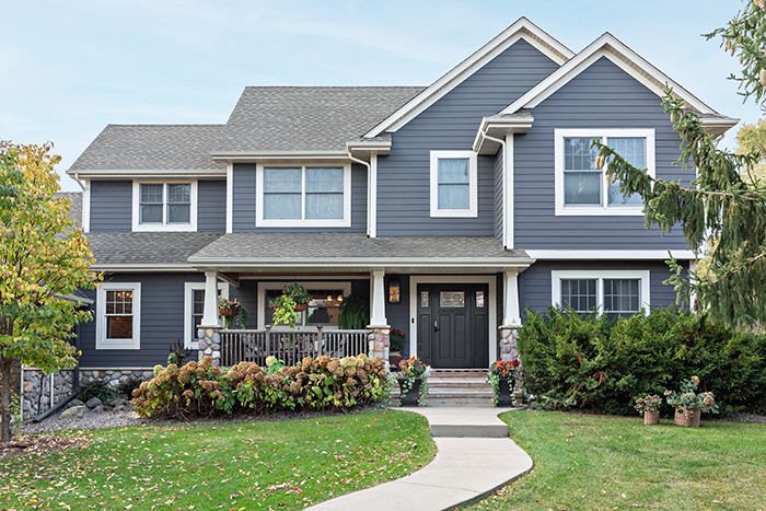 Front view of a full house with brand new Renewal by Andersen Windows and Doors